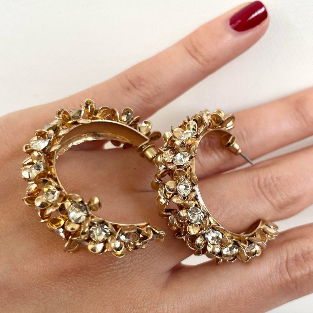 Vintage-style gold floral hoop earrings with rhinestone flowers